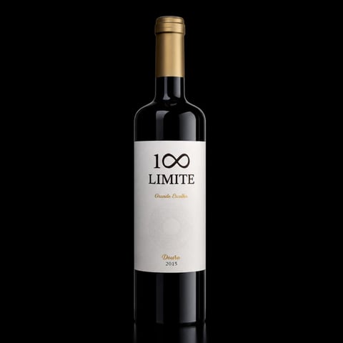 100 Limite wine bottle with white label and gold capsule on black background, vintage 2015 douro red wine