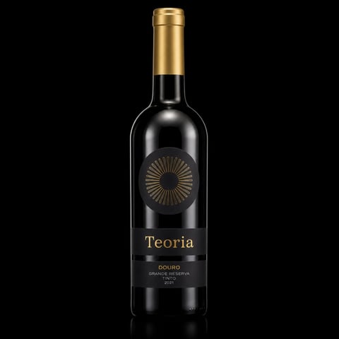 Bottle of Teoria Douro red wine with gold cap and sunburst label on black background