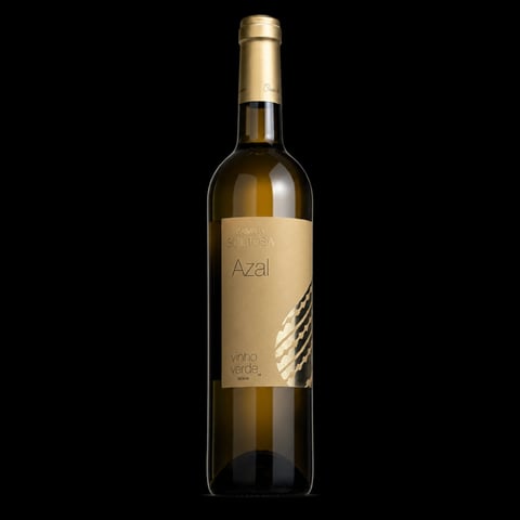 Bottle of Azal white wine with tan label and cork on black background