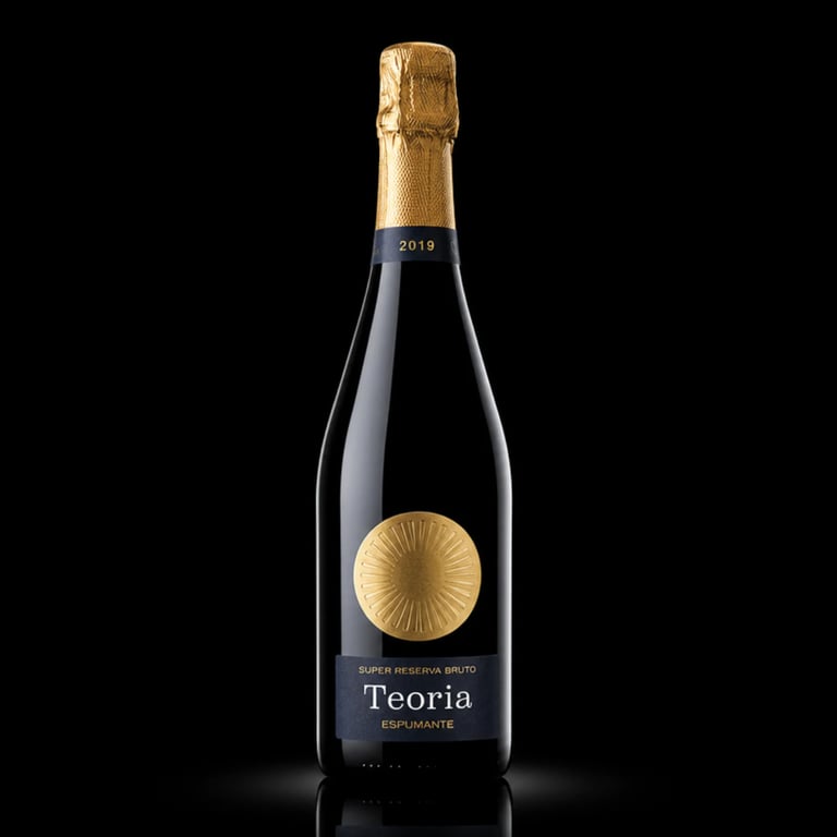 Bottle of Teoria sparkling wine with gold foil cap and label featuring a sun motif on black background